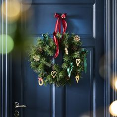 a christmas wreath hanging on the front door