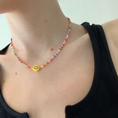 -this necklace will make you smile with these rainow hues -perfect trendy everyday necklace -glass seed beads with plastic smiley face Smile Beads Necklace, Kalung Beads, Trendy Beaded Necklace, Beads Craft Kids, Smiley Beads, Smiley Necklace, Smile Necklace, Craft Kids, Beads Craft