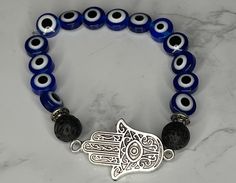 Evil Eye is your protector of positive energy. With these healing beads you are granting yourself the protection of all bad things against you. Spiritual Hand-strung Evil Eye Bracelet For Healing, Spiritual Evil Eye Bracelet With Gemstone Beads As Gift, Adjustable Spiritual Evil Eye Bracelet For Meditation, Spiritual Beaded Evil Eye Bracelet For Healing, Spiritual Healing Evil Eye Bracelet With Round Beads, Spiritual Evil Eye Bracelet With 8mm Beads, Handmade Spiritual Evil Eye Bracelet For Meditation, Spiritual Hypoallergenic Evil Eye Bracelet Gift, Eye Of Protection