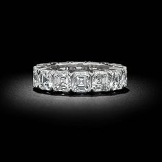 a diamond ring on a black background