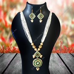 This is a stunning handmade necklace perfect for high end Jewelry Collector, a keeper in Traditional Vintage Indian/Pakistani Bridal jewelry and a Luxury Gift for your Daughter, Sister or Wife on Wedding or Anniversary. Perfect for any type of occasions, weddings And celebrations and a beautiful & memorable gift for weddings and special occasions. -Item Code:- L2019 -White Beaded Rajwada Necklace Set with Earrings. -Gold Plated Set with Kundan Stones which shine like polki. -Metal: Gold plated brass -Earrings are 60mm long and 30mm wide -Necklace length with pendant 12" approx  -Meenakari on kundan Set. -Quantity:- One Necklace Set Please see more different designs here:- https://www.etsy.com/in-en/shop/LUCKYJEWELSART?ref=seller-platform-mcnav I make every item of my collection with a lot White Temple Jewelry Necklaces For Jewelry Making, White Temple Jewelry Necklaces, White Temple Jewelry Necklace For Gift, White Temple Jewelry Necklace Gift, Handmade White Temple Jewelry Bridal Necklace, Handmade White Temple Jewelry Necklace, Handmade White Bridal Temple Jewelry Necklace, Temple Jewelry Style Necklace With Beaded Chain For Wedding, Temple Jewelry Necklaces With Beaded Chain For Wedding