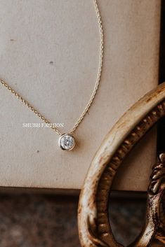 6 mm Round Moissanite Diamond Necklace, Bezel Solitaire Necklace, Layered Necklace, Dainty Necklace, Gold necklace Bridesmaid Gift, Diamond Pendant, Engagement Gift For Fiancée , Diamond Pendant For Gorgeous Gift, Solitaire Women's Pendant, Gift For Friendship Day ✦ STONE DETAIL ✦ ✧ Stone Shape : Round ✧ Stone Size : 6mm ✧ Stone Weight : 0.80 Carat Approx ✧ Stone Color : D (Color less) ✧ Stone Clarity: VVS ✦ 𝐌𝐞𝐭𝐚𝐥 𝐃𝐞𝐭𝐚𝐢𝐥𝐬 ✦ ✧ Metal Type : 925 Silver, Yellow Gold , Rose Gold, White Go Formal Round Birthstone Necklace With Delicate Chain, Dainty Round Bridal Necklace For Formal Occasions, Gift Solitaire Necklace With Bezel Setting And Round Stone, Gift Solitaire Necklace With Round Bezel Setting, Solitaire Necklace With Bezel Setting For Gift, Dainty Solitaire Gemstone Necklace For Formal Occasions, Elegant Necklace With Bezel Setting And Round Stone, Elegant Round Birthstone Necklace With Bezel Setting, Dainty Bezel Set Solitaire Necklace For Anniversary