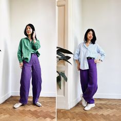 two women standing next to each other in front of a white wall and one wearing purple pants