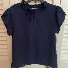 Navy Blue Short-Sleeved Blouse With Button-Front Closure; Sz 13-14 - Never Worn Blue Cotton T-shirt With Ruffles, Blue Ruffled T-shirt For Summer, Casual Navy Short Sleeve Blouse, Casual Blue Tops For Work, Blue Casual Workwear Top, Navy Short Sleeve Blouse For Summer, Navy Short Sleeve Top For Spring, Blue Short Sleeve Shirt With Ruffles, Blue Short Sleeve Blouse For Work