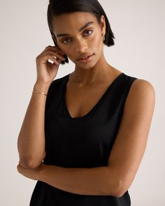 We're all about upgrading the essentials. This classic tank is made from washable silk, with a bit of stretch for the perfect fit. Effortless. A-line. No dry cleaning runs needed. Perfect for layering at the office or days lounging at home. Plus, silk fiber contains 18 kinds of amino acids that make it amazing for skin nourishment, hypo-allergenic, and naturally thermoregulating to help maintain body temperature. Also offered in sizes 1X - 3X.  | Quince | Women's 100% Washable Silk Stretch Tank Elegant Scoop Neck Tank Top For Everyday, Elegant Fitted Camisole For Everyday, Elegant Fitted Everyday Camisole, Elegant Scoop Neck Tank Top With Minimal Stretch, Elegant Seamless Tank Top With Minimal Stretch, Elegant Spring Tank Top With Minimal Stretch, Elegant Seamless Tank Top For Layering, Elegant Stretch Tank Top For Work, Sleek Tank Top For Summer Workwear