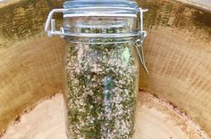 a glass jar filled with lots of green stuff