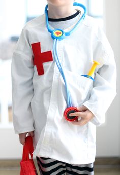 a little boy dressed up as a doctor