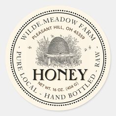 a sticker with the words, honey and an image of a beehive