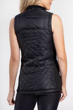 The perfect layering item to bring you from your workout to coffee to grocery shopping. Quilted fabric in diamond design Knit side panel for a flattering fit Zip pockets Winter Stretch Nylon Vest, Black Nylon Vest With Functional Pockets, Black Sleeveless Nylon Vest, Fitted Vest For Outdoor Activities, Sleeveless Vest With Functional Pockets, Nylon Sleeveless Vest For Layering, Fitted Nylon Outdoor Vest, Sporty Outdoor Vest With Side Pockets, Fitted Casual Nylon Vest