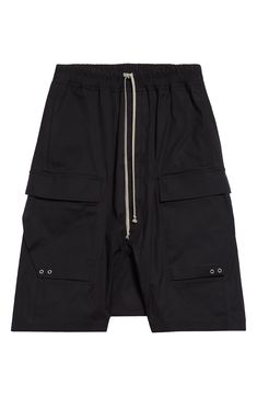 Angluar cargo pockets bring signature Rick Owens edge to these stretchy cotton cargo shorts. 36" inseam; 32" leg opening; 13 1/2" front rise; 17 1/2" back rise (size 50EU) Elastic/drawstring waist Cargo bellows pockets 97% cotton, 3% elastane Hand wash, line dry Made in Italy Designer Clothing Streetwear Cargo Pants With Hip Pockets, Short Length Cargo Pants For Streetwear, Streetwear Cargo Pocket Short Pants, Short Cargo Pants With Patch Pockets For Streetwear, Cargo Style Knee-length Shorts For Streetwear, Utility Knee-length Shorts For Streetwear, Baggy Cargo Shorts With Side Pockets For Streetwear, Knee-length Cargo Shorts For Streetwear, Utility Short Pants With Cargo Pockets