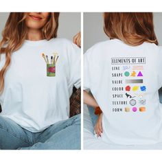 a woman wearing a white t - shirt with the words elements of art printed on it