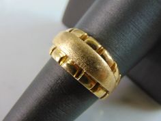 "A WOMENS VINTAGE ESTATE 18K YELLOW GOLD MODERNIST RING. THE TOTAL WEIGHT IS 10.7g AND IS A SIZE 8.25. THE WIDTH OF THE RING IS 3/8\". RING IS STAMPED 750 ON THE INSIDE OF THE BAND. ANY QUESTIONS, PLEASE DON'T HESITATE TO ASK. THIS WOULD MAKE A GREAT GIFT FOR THAT SOMEONE SPECIAL. BE SURE TO CHECK OUT SOME OF OUR OTHER GREAT ITEMS UP FOR SALE. THANK YOU." Citrine Bracelet, Modernist Ring, Cz Ring, Onyx Ring, The Band, The Ring, New People, Sterling Silver Bracelets, Vintage Men