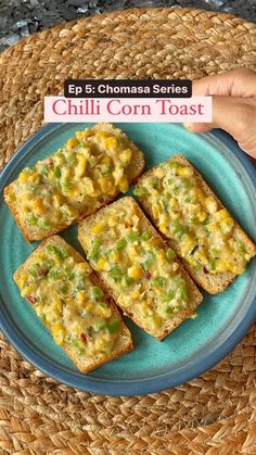 a plate with four pieces of corn bread on it and the words chilli corn toast