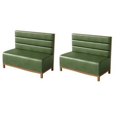 a pair of green upholstered sofas with wooden legs and backrests