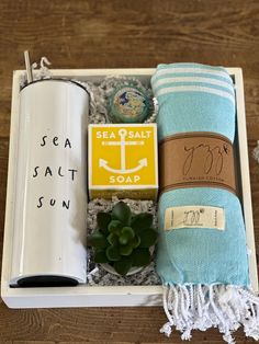 an open box with towels, soap and sea salt