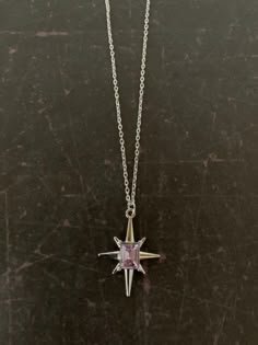 "Lovely silver tone 8 point star necklace with center emerald cut lilac stone, star necklace silver, 8 point star pendant, lilac stone necklace, heather necklace, star gift Pendant measures 1\" L X 7/8\" W and is on an 18\" chain.   ★ Want to see more?  Please visit my shop at: https://www.etsy.com/shop/DesignsByPeg" Seoul Trip, 8 Point Star, Lilac Stone, Space Necklace, Star Necklace Silver, Necklace Star, Saint Marys, Star Gift, Funky Jewelry