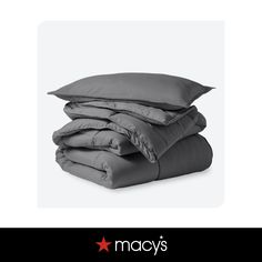 three pillows stacked on top of each other with the words macy's above them