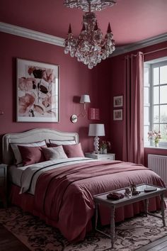 a bedroom painted in pink and white with a chandelier hanging from the ceiling