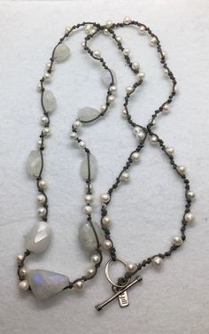 "A beautiful single strand hand knotted by designer J.jill natural pearl and rough moonstone with nice toggle clasp in good condition measures 32\" long." Boho Pearl Necklace, Bohemian Lariat Pearl Jewelry, Bohemian Lariat Jewelry With Pearl Drop, Bohemian Hand-strung Pearl Jewelry, Handmade Pearl Lariat Jewelry, Adjustable Silver Hand Knotted Necklace, Silver Hand Knotted Adjustable Necklace, Adjustable Baroque Pearl Jewelry With Natural Stones, Bohemian Long Single Strand Pearl Necklace