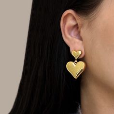 Crafted in a double drop heart design, the Aria Heart Drop Earrings are the perfect accessory for any outfit. The surface is highly reflective, creating a beautiful and eye-catching effect. With their showstopping style, the earrings are lightweight and comfortable, so you can keep making a statement without ever feeling weighed down. Material: gold vermeil (sterling silver with heavy gold plating) Drop length: 1.4"/ 35mm Cheap Minimalist Earrings For Valentine's Day, Trendy Pierced Heart Earrings, Trendy Heart Drop Earrings For Anniversary, Trendy Heart-shaped Drop Earrings For Anniversary, Trendy Anniversary Heart Drop Earrings, Valentine's Day Heart Detail Earrings, Heart Detail Double Heart Earrings For Gift, Trendy Double Heart Pierced Earrings, Trendy Heart-shaped Earrings For Anniversary