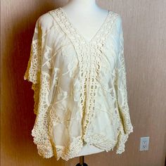 This Sexy, And Very Feminine Soft Lace Top, Decorated With Crochet Detail. Enjoy It With Slacks, Over A Bathing Suit, Or With A Sexy Tight Pair Of Jeans. No Tags, But Never Worn Lace V-neck Tops For Festivals, Stretch Lace Top With Crochet Trim, Fitted Crochet Lace Blouse For Vacation, Fitted Lace Blouse For Vacation, Fitted Lace Work Top For Beach, Summer V-neck Crochet Lace Top, Summer Stretch Lace Blouse, Summer Lace Crochet Top V-neck, Bohemian Stretch Lace Top For Spring