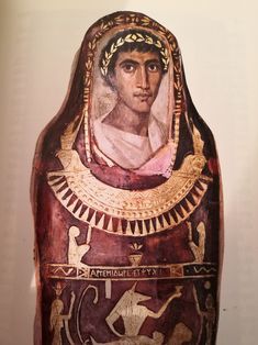 an ancient greek vase with a painting of a man on it's face and head