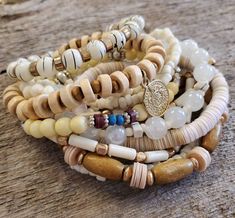 Seven stretch bracelets Cheap Bohemian Stackable Stretch Bracelet, Bohemian Beige Stretch Bracelet As Gift, Bohemian Adjustable Stackable Stretch Bracelet, Stackable Spiritual Bangle Stretch Bracelet, Spiritual Stackable Bangle Stretch Bracelet, Bohemian White Stacked Bracelets, Bohemian Beige Stretch Bracelet With Round Beads, White Bohemian Stacked Bracelets, Adjustable Beige Stretch Bracelet