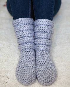 a woman's legs wearing knitted gray socks