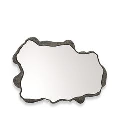 a mirror that is sitting on top of a white wall with a black border around it