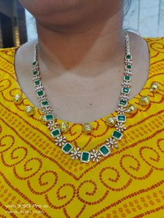 Gorgeous 18K Gold 2-in-1 Diamond 2 line Necklace with Green Color Stone 
   This is a 2-in-1 TWO line necklace. 
  The 2 lines can be detached and worn separately 
as one  medium length single line necklace or   as one short length single line necklace or 
  together as a two line necklace - 1-BG-DN-SET06145 - in 83.310 Grams for USD $15046.90. 
Made in India by Totaram Jewelers Online this product is in Gold - 18 Karat Gold  & is an excellent gift for Adult - Women. Ships fully insured with Single Line, Color Stone, Gifts For Adults, Medium Length, Green Color, Green Colors, Stone Color, 18k Gold, India