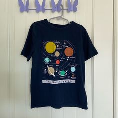 Boy’s Gap Kids Tshirt. Shirt Is Dark Navy Blue In Color With A Large Solar System Decal On The Front. Size Medium. Smoke Free Home! Solar System Graphic, Gap Kids Boys, Kids Tshirt, Gap Kids, Dark Navy Blue, Kids Tops, Solar System, Dark Navy, Kids Shirts