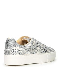 a women's white sneaker with silver sequins