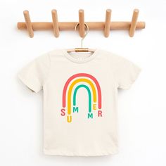 Looking for a cute tee for your kids? We have the perfect Rainbow Summer graphic tee addition to their closet! Also available in toddler tees. Trendy Spring Playtime T-shirt, Family Matching Summer T-shirt With Screen Print, Cute Multicolor Graphic Print T-shirt, Screen Print Short Sleeve T-shirt For Playtime, Cute Letter Print T-shirt For Playtime, Rainbow Print Cotton T-shirt With Short Sleeves, White Cotton T-shirt With Rainbow Print, Summer Playtime Tops With Letter Print, Rainbow Graphic Print Top For Summer