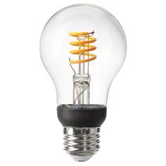 an electric light bulb with orange spirals in it's glass cover on a white background