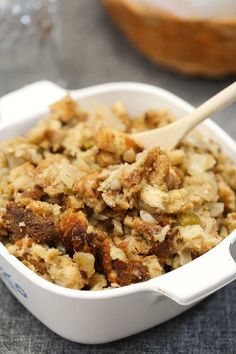 a close up of a bowl of food with a spoon