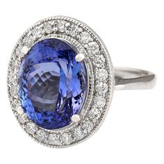 Stamped: 14K White Gold Total Ring Weight: 8.3 Grams Ring Length: N/ARing Width: N/A Gemstone Weight: Total Natural Tanzanite Weight is 9.51 Carat (Measures: 14.30x11.90 mm) Color: Blue Diamond Weight: Total Natural Diamond Weight is 0.60 Carat Quantity: 24 Color: F-G, Clarity: VS2-SI1 Face Measures: 20.90x18.20 mm Sku: [703437W] Classic Oval Gemstones With Halo Setting, Classic Oval Platinum Gemstones, Oval Center Stone Gemstones For Formal Occasions, Oval Gemstones With Halo Setting For Formal Occasions, Gia Certified Classic Gemstones For Formal Occasions, Classic Gia Certified Gemstones For Formal Occasion, Classic Platinum Gemstones With Halo Setting, Formal Oval Gia Certified Sapphire Ring, Oval Gia Certified Sapphire Ring For Formal Occasions