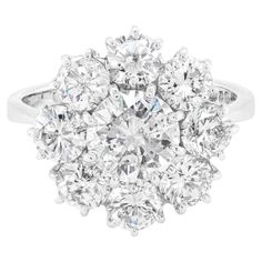 Check out this item from 1stdibs! 18 Carat White Gold Large Diamond Cluster Engagement Ring, England, 1973: https://www.1stdibs.com/id-j_19165732 Luxury Flower Shape Cluster Ring With Brilliant Cut, Princess Cut Diamond Cluster Ring, Luxury Dazzling Cluster Ring With Brilliant Cut, Antique White Cluster Ring Luxury, Luxury Cluster Diamond Ring With Pave Setting, Luxury Cluster Halo Ring In Fine Jewelry, Large Diamons Made Into Clusters, Luxury Diamond White Cluster Diamond Ring, Diamond Cluster Engagement Ring