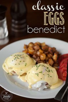 an image of eggs benedict on a plate with potatoes and tomatoes in the background text reads classic eggs benedict