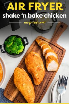 air fryer chicken on a cutting board with broccoli and other food items