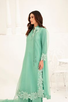 This light green Shalwar Kameez features a mint green organza lined shirt with lace appliqué all over the body and chaak, accompanied by a matching organza cutwork dupatta. The delicate lace adds an elegant touch to the traditional style, making this outfit perfect for any formal occasion. 3-Piece Suit Green Shalwar Kameez, Organza Cutwork Dupatta, Organza Cutwork, Shirt With Lace, Shalwar Kameez, 3 Piece Suits, Cut Work, Lace Applique, Wedding Men