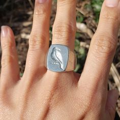 This signet ring is cast in lead-free pewter. The ring size when cast is 7.25. The sealing image is a raven. the raven quothe whatever you want it to This is part of a series of signet rings I am making cast from lead-free pewter. Each master ring is hand sculpted to give a unique, rustic style, multi-dimensional relief image when used as a stamp to seal, with sealing wax. Pewter Ring, Seal Wax, Seal Ring, Resize Ring, Multi Dimensional, Signet Rings, Sealing Wax, The Raven, Skull Ring