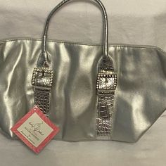 New Silver Bag, Never Used. Rectangular Bag With Snap Closure As Gift, Silver-tone Hardware Shoulder Bag As Gift, Gift Shoulder Bag With Silver-tone Hardware, Elegant Rectangular Diaper Bag With Adjustable Strap, Silver Bags With Snap Closure, Silver Bag With Snap Closure For Everyday, Silver Bags With Snap Closure For Everyday Use, Silver Bag, Golden Goddess