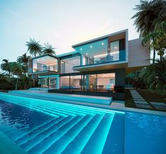 a modern house with swimming pool and palm trees