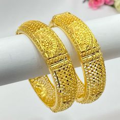 22k Gold Plated Openable Bangles/Kangan/kare/Bridal Indian Jewelry Wedding Jewellery It is a perfect match with formal attire on special occasions or with casual wearing Care instructions Keep Jewellery away from direct heat, water, perfumes, deodorants and other strong chemicals as they may react with the metal or plating. The plating composition of Jewellery is as such that  perspiration (sweat) will not damage it. Wipe Jewellery gently with chamois cloth or leather swatch after every use. Wiping the jewellery with a soft cloth after removing the jewellery would add to its life. Avoid water  exposure for all jewelry  Thank You For Visiting Elegant Gold Bridal Sets With Cutdana, Gold Bridal Sets With Meenakari For Formal Occasions, Formal Gold Bridal Sets With Meenakari, Gold Meenakari Bridal Sets For Formal Occasion, Formal Bridal Sets With Meenakari For Festivals, Festive Formal Bridal Sets With Intricate Design, Gold Bridal Sets For Formal Occasions And Festivals, Bollywood Style Gold Traditional Wedding Wear, Gold Wedding Traditional Wear With Pallu