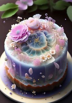 there is a cake with flowers on the top and frosting around it, sitting on a plate