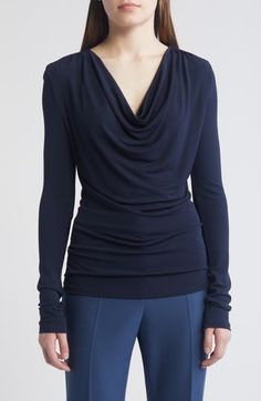 A draped neck creates lavish folds down the front of this knit top providing an intriguing counterpoint to the style's slim, figure-skimming fit. Cowl neck Long sleeves 100% viscose Machine wash, dry flat Imported Elegant Ruched Tops For Layering, Chic Draped Elastane Tops, Ruched Draped Top In Elastane, Ruched Draped Elastane Top, Elegant Ruched Foldover Top, Versatile Fitted Cowl Neck Top, Versatile Fitted Draped Top, Chic Draped Stretch Tops, Chic Fitted Knit Top With Foldover Design