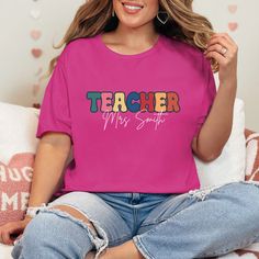 Personalized "TEACHER" T-Shirt ️ Looking for the perfect gift for your favorite teacher? Our personalized "TEACHER" t-shirt is a stylish and thoughtful way to show appreciation! 🌟👕 Crafted with love and attention to detail, this shirt can be customized with the name or message of your choice, making it a truly unique gift.  Features: ✨ High-quality, soft cotton blend for ultimate comfort ✨ Customizable with any name ✨ Available in multiple colors and sizes ✨ Durable print that lasts through ma Back To School Teacher Appreciation T-shirt, Pink Relaxed Fit T-shirt For School, Short Sleeve T-shirt With Name Print For Teacher Appreciation, Custom Print Crew Neck T-shirt For Teacher Appreciation, Teacher Appreciation Crew Neck T-shirt For Back To School, Back To School T-shirt With Text Print For Teaching, School Spirit T-shirt With Name Print For Teacher Appreciation, School Spirit T-shirt With Text Print For Teacher Appreciation, Back To School Text Print T-shirt For Teaching