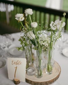 there are flowers in vases on the table