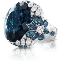 Indulge in pure luxury with the 18k White Gold Ghirlanda Couture Ring from Pasquale Bruni. This exquisite piece features a breathtaking London Blue Topaz gemstone that sparkles in the light, surrounded by a halo of diamonds that perfectly complement its blue hues. The ring's intricate design is reminiscent of delicate garlands, creating a truly unique and timeless piece that exudes elegance and sophistication.Crafted from the finest 18k white gold, this ring is a true masterpiece of Italian craf Luxury Unique Style Sapphire Ring, Exquisite Luxury Sapphire Wedding Ring, Luxury Formal Sapphire Ring With Multi-stone, Luxury Unique Sapphire Ring For Women, Luxury Unique Sapphire Ring, Luxury Unique Sapphire Ring With Polished Finish, Luxury Sapphire Ring With Accent Stones, Luxury Sapphire Ring With Gemstone Accents, Luxury Large Stone Sapphire Ring