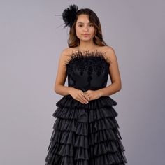 DETAILS: 2-piece set includes: adult size corset & full-length skirt Strapless satin corset with velvet damask pattern & gorgeous ostrich feathers Black multi-layered, multi tiered bridal tulle skirt Zippers in back Cotton lining Color may vary due to lighting on images Matching daughter dress also available! PRE ORDER & CUSTOM: Mommy items take on average 3-4 weeks to prepare and ship If you have a specific date you need this item by, please reach out to our team at info@ittybittytoes.com. For Tulle Ball Gown With Attached Cancan For Debutante Ball, Black Ruffled Dress For Debutante Ball, Strapless Feather Trim Wedding Dress, Strapless Wedding Dress With Feather Trim, Evening Corset With Attached Cancan, Evening Corset Dress With Attached Cancan, Black Tiered Skirt Dress For Wedding, Evening Gown With Attached Cancan In Tulle, Black Tiered Skirt Wedding Dress